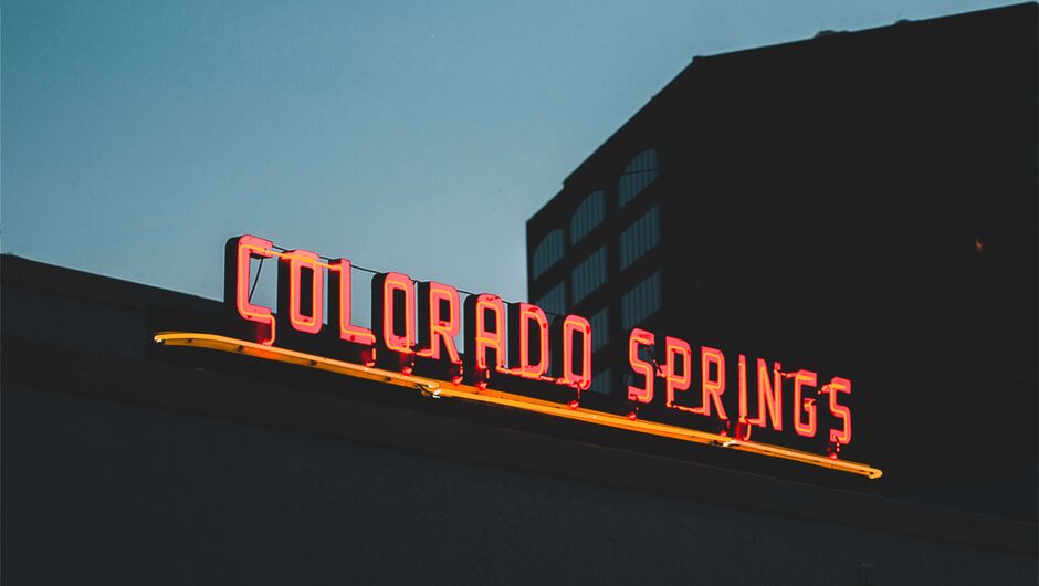A neon sign reads Colorado Springs.