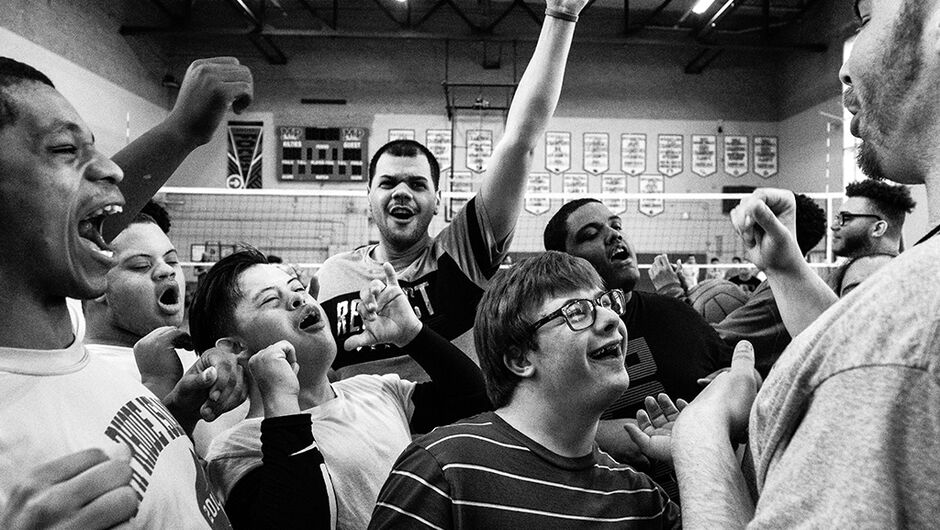 A group of basketball players cheering